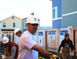 Mike Bugbee, senior vice president for Simpson Strong-Tie, works on a home in Oakland, Calif., during a corporate volunteer day. Simpson Strong-Tie has renewed its partnership with Habitat for Humanity for a sixth year. 