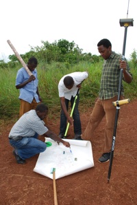 A Watoto engineering and construction crew locates the property boundary for Suubi village with the aid of a HiPer GA GPS+ receiver from Topcon Positioning Systems.